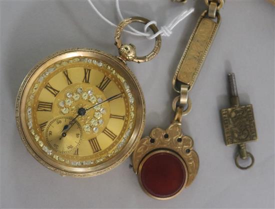 An engraved 14ct gold pocket watch and a fancy gilt metal albert with spinning fob.